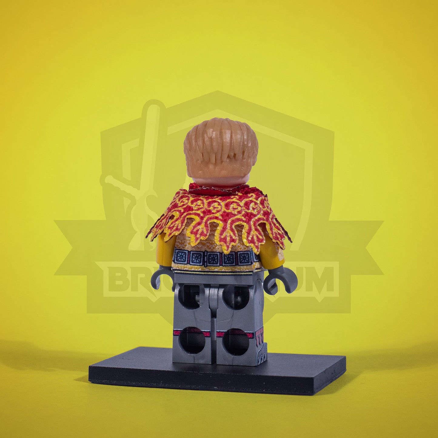 Minifigure of a Sir Capon with a shield and sword on a yellow background