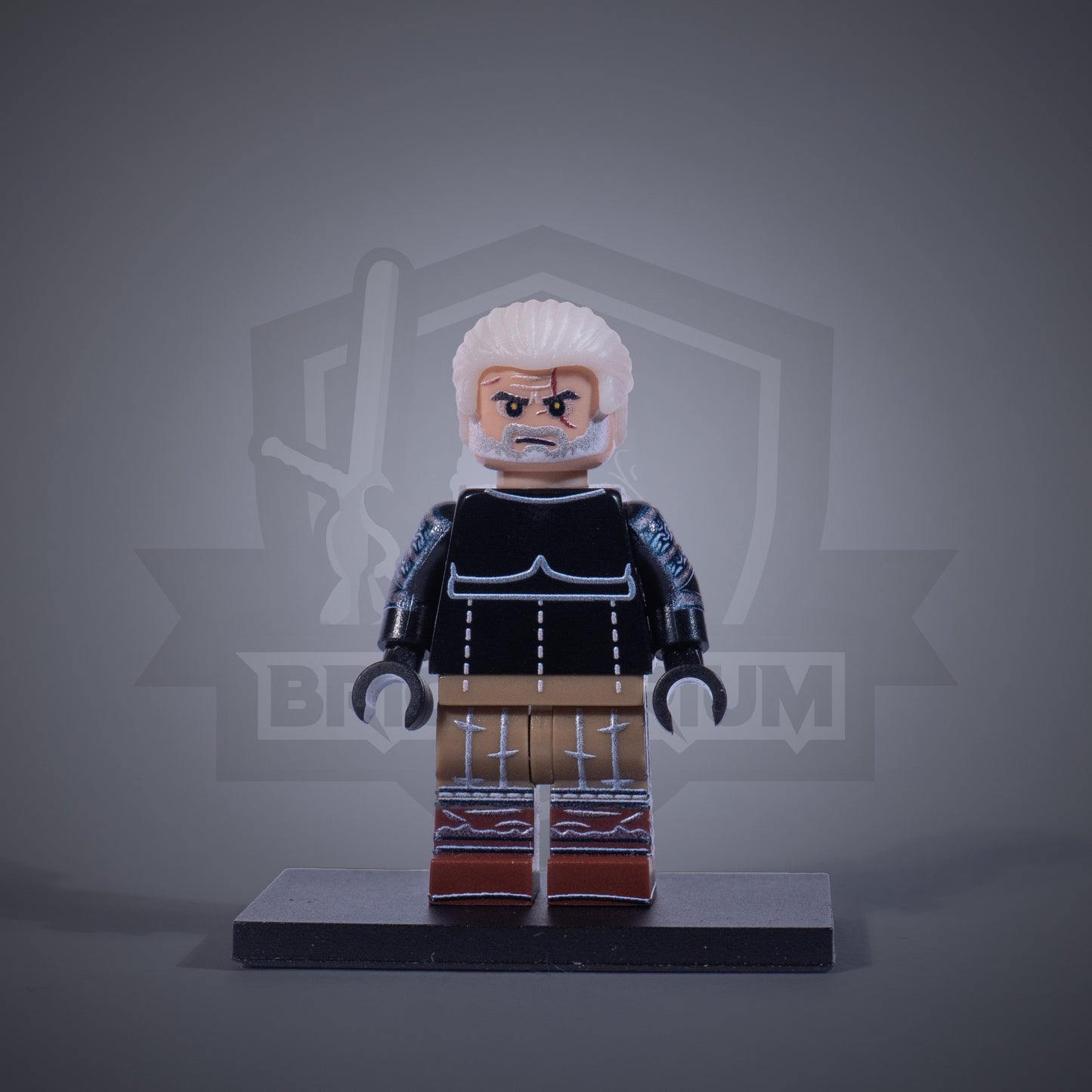 Toy figure of a Witcher without armor on a gray background