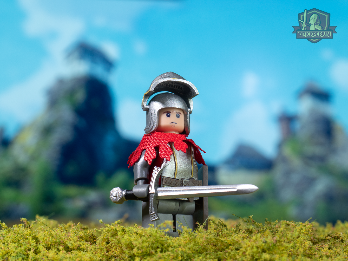 Toy figure of a knight with armor and a sword in front of a blurred natural background