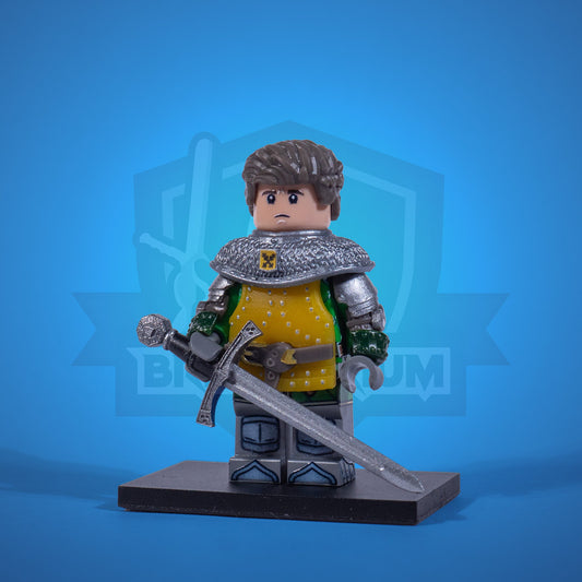 Toy figure of a warrior Henry in armor with a sword on a blue background