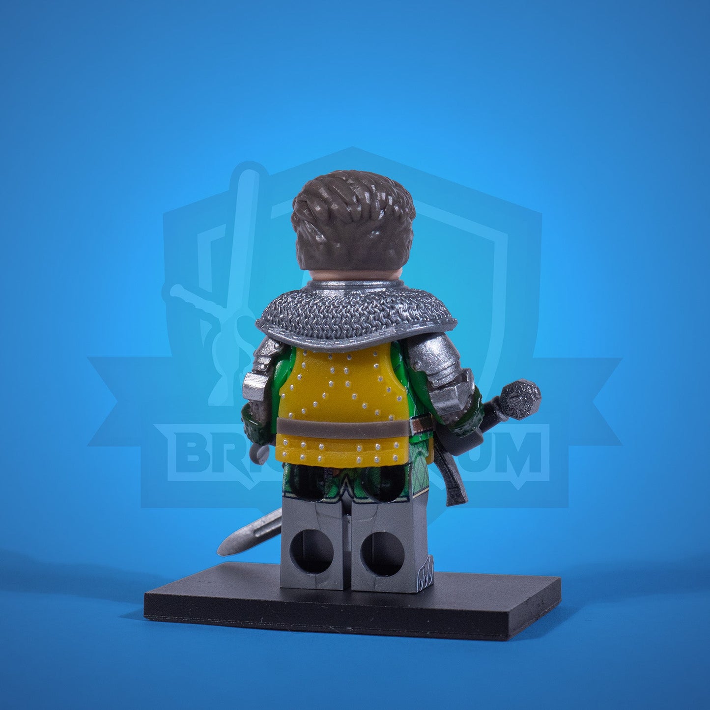 Toy figure of a warrior Henry in armor with a sword on a blue background