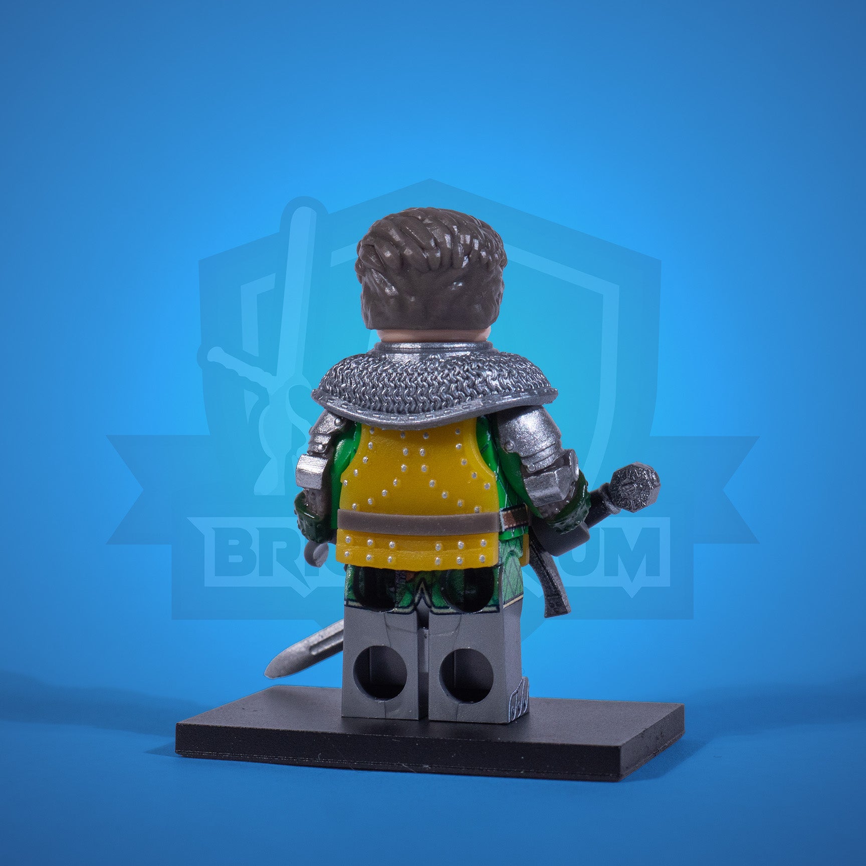 Toy figure of a warrior Henry in armor with a sword on a blue background