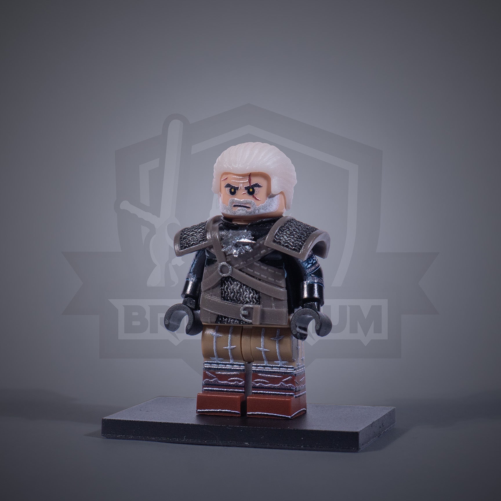 Toy figure of a Witcher with armor and two swords on a gray background