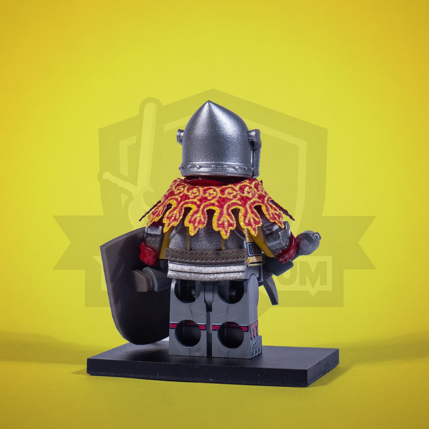 Minifigure of a Sir Capon with a shield and sword on a yellow background