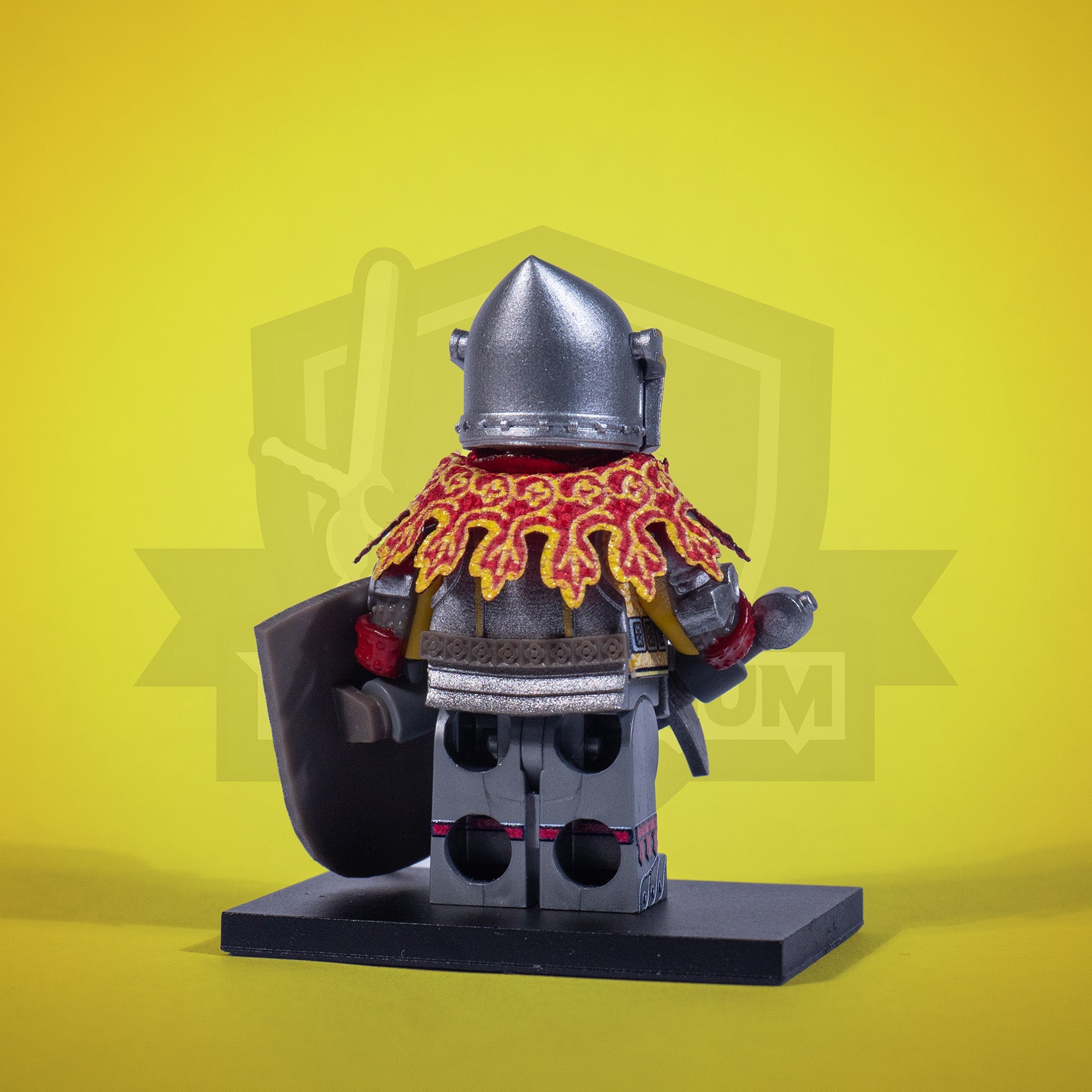 Minifigure of a Sir Capon with a shield and sword on a yellow background